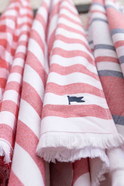 Red and white striped Turkish cotton peshteri beach and pool towels for home