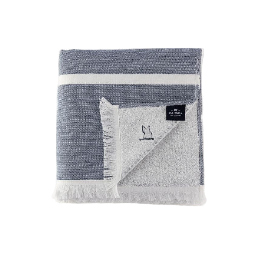 The Barcelona Stripe Beach Towel folded back to show the soft terry side